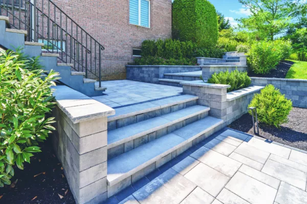 Explore the elegance of Scenic View Landscaping's stone steps and patio, perfectly blending functionality with modern aesthetics.