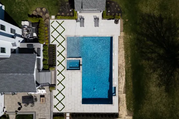 Explore this complete backyard transformation in Lincroft, NJ, by Scenic View Landscaping, featuring detailed landscaping, elegant hardscaping, lush turf inlay, and strategic outdoor lighting. See how we create luxurious, functional outdoor living spaces.