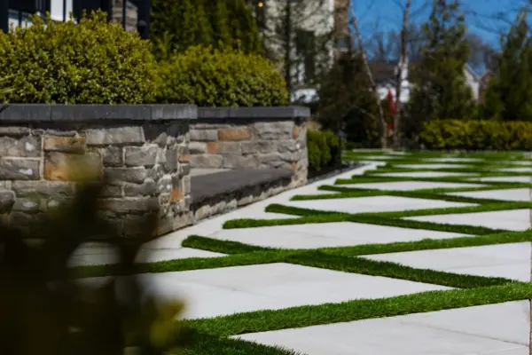 Explore this complete backyard transformation in Lincroft, NJ, by Scenic View Landscaping, featuring detailed landscaping, elegant hardscaping, lush turf inlay, and strategic outdoor lighting. See how we create luxurious, functional outdoor living spaces.