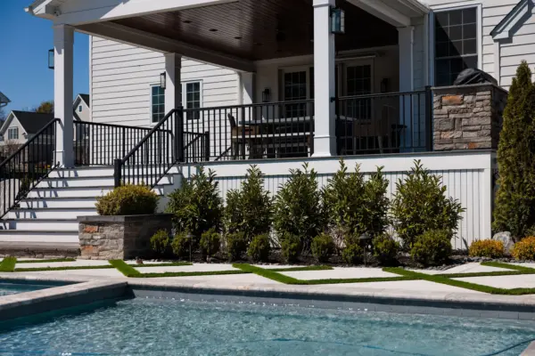 Explore this complete backyard transformation in Lincroft, NJ, by Scenic View Landscaping, featuring detailed landscaping, elegant hardscaping, lush turf inlay, and strategic outdoor lighting. See how we create luxurious, functional outdoor living spaces.